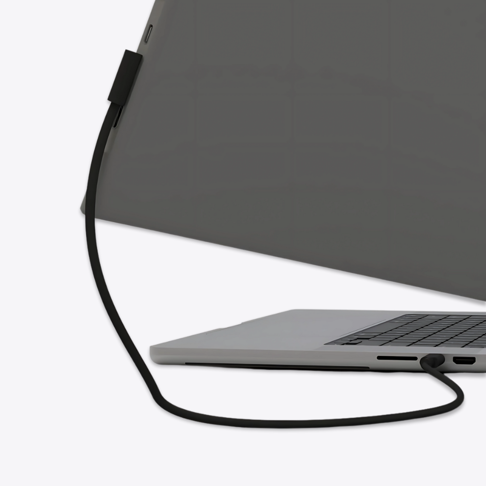 Close-up of Falco Lite 15.6 portable monitor connected via USB-C to laptop